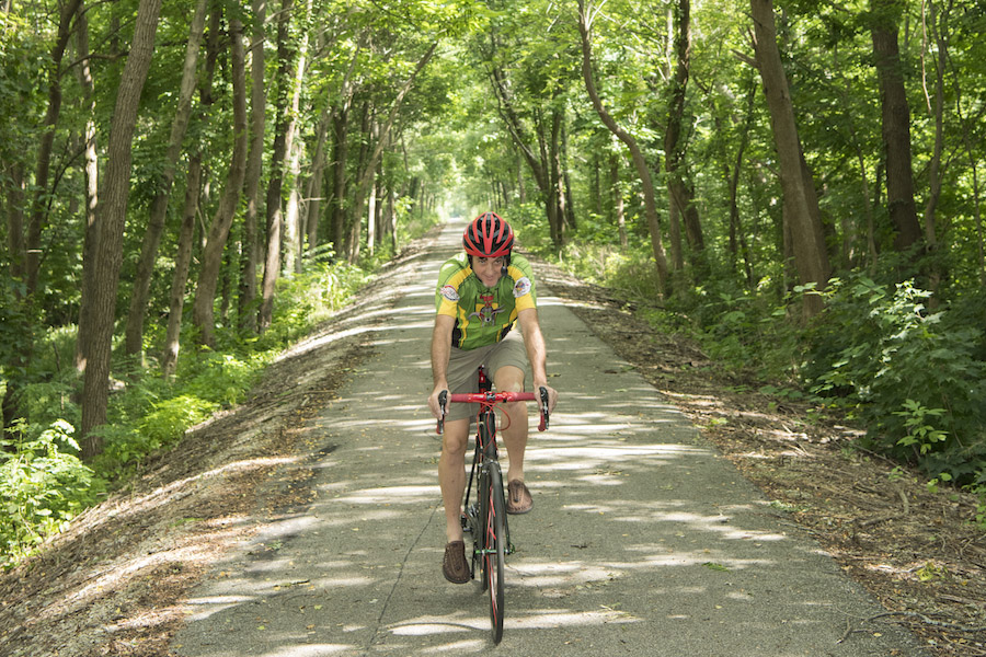 A trail user enjoys a peaceful ride along the Cardinal Greenway near the Medford Trailhead. | Photo by Tony Valainis