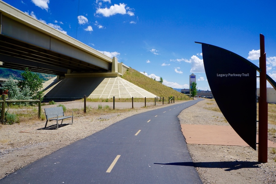 The Legacy Parkway Trail in the Salt Lake City, Utah, area passes through a variety of neighborhoods. In Farmington, it runs along a freeway and a railroad track, as well as a transit stop and a busy shopping area. | Photo by Cindy Barks