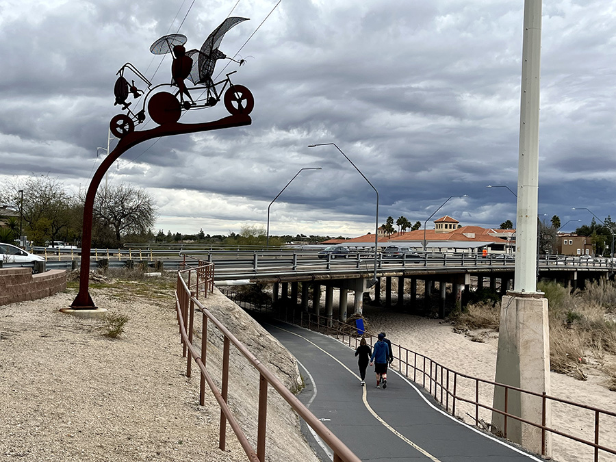 The Batty Biker Family sculpture, located at Campbell Avenue along the nearly 22-mile Rillito River Park Trail, is one of dozens of public art pieces featured on The Loop. | Photo by Cindy Barks