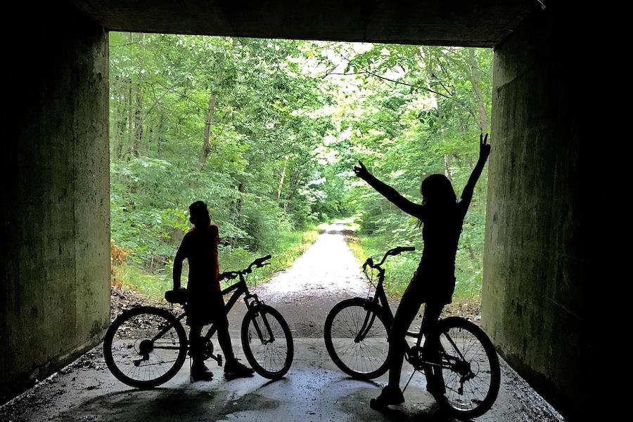 While the eponymous 543-foot tunnel on the Tunnel Hill State Trail is impressive, the 55-mile pathway also boasts 23 trestle bridges and views of spectacular bucolic and forested landscapes in rural southern Illinois. Photo by TrailLink user amandarobertsphotography.