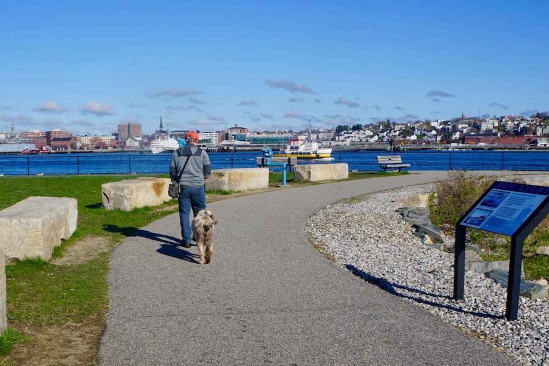 The park at the Bug Light lighthouse is a popular spot for runners, bicyclists and dog walkers. South Portlander Mark MacIsaac, shown here with his dog Phoebe, is among the locals who use the park on a regular basis. Photo by Cindy Barks.