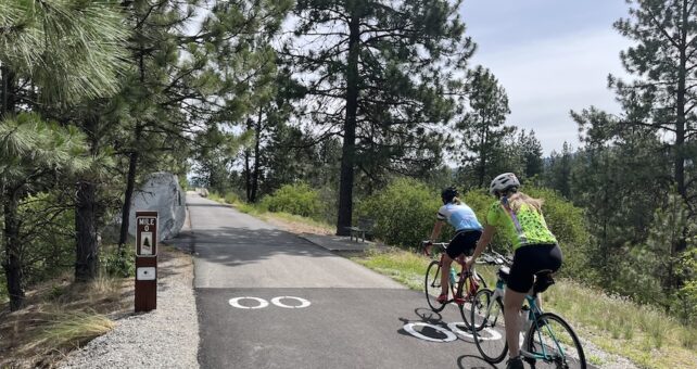 Riders pass the Washington/Idaho state line into Idaho, where the trail becomes the North Idaho Centennial Trail and continues on toward Coeur d’Alene, Idaho, and to the east. Photo by Cindy Barks