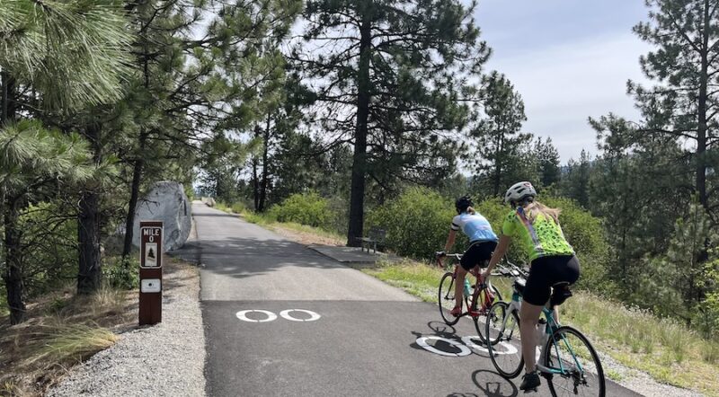 Riders pass the Washington/Idaho state line into Idaho, where the trail becomes the North Idaho Centennial Trail and continues on toward Coeur d’Alene, Idaho, and to the east. Photo by Cindy Barks