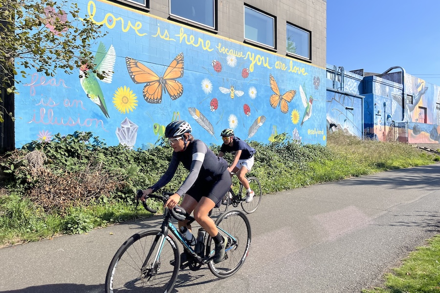 Bicyclists by a mural along Washington's Burke-Gilman Trail | Photo by Cindy Barks